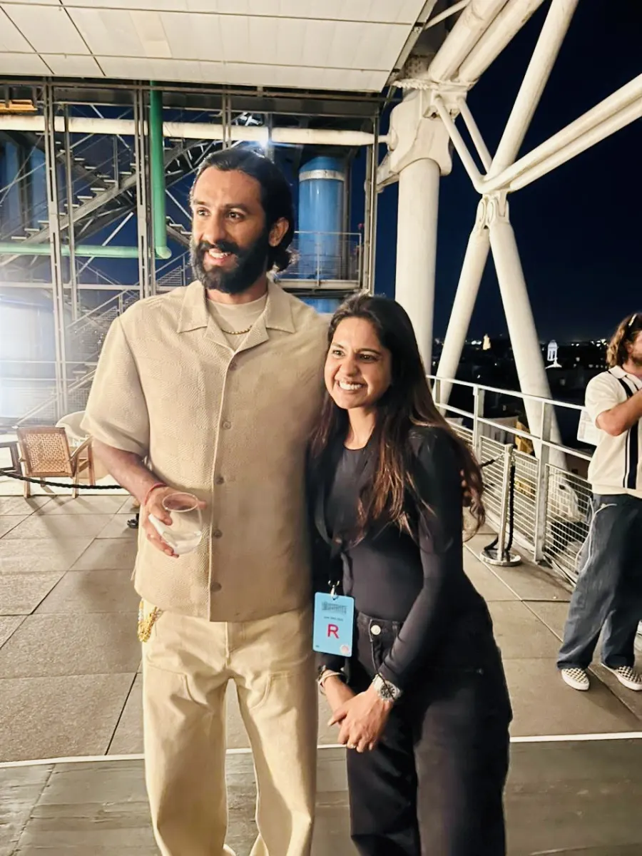 Shailza Swami with a guest on a Paris rooftop terrace at night